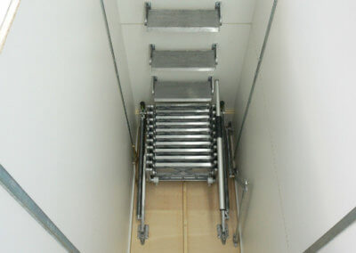 Supreme loft ladder with deep hatch. Shown with additional treads and grab rail. Premier Loft Ladders