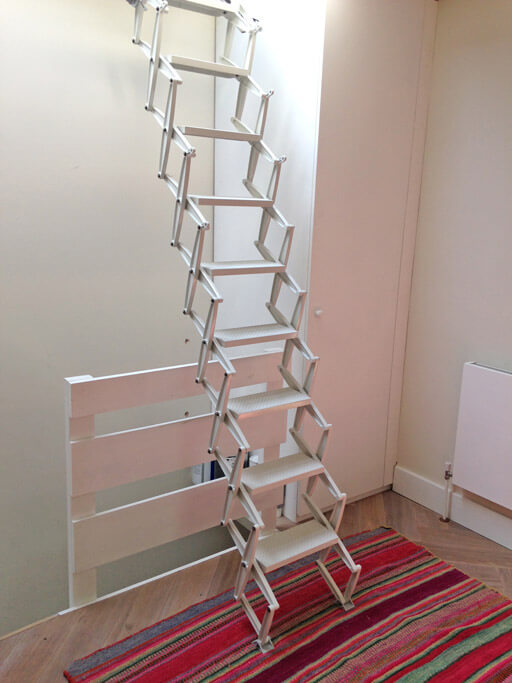 Elite concertina loft ladder for access to skylight over staircase. Elite concertina loft ladder for access to skylight over staircase.