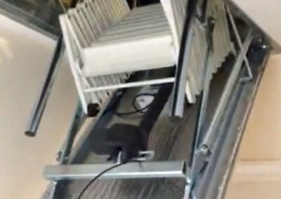Automatic loft ladders. The Escalmatic during opening