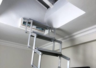 Piccolo Premium loft ladder fitted beneath a small roof light