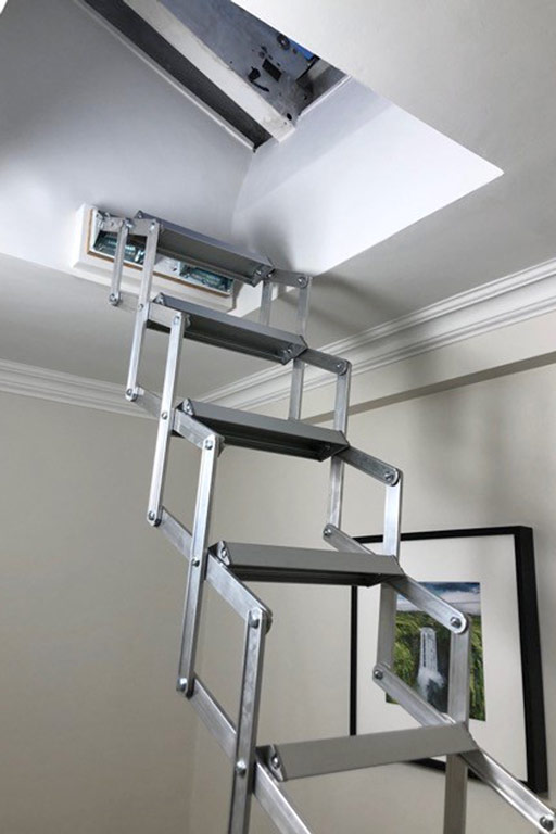 Piccolo Premium loft ladder fitted beneath a small roof light