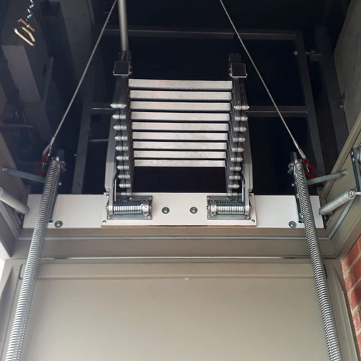 Elite concertina loft ladder fitted to steel hatch box