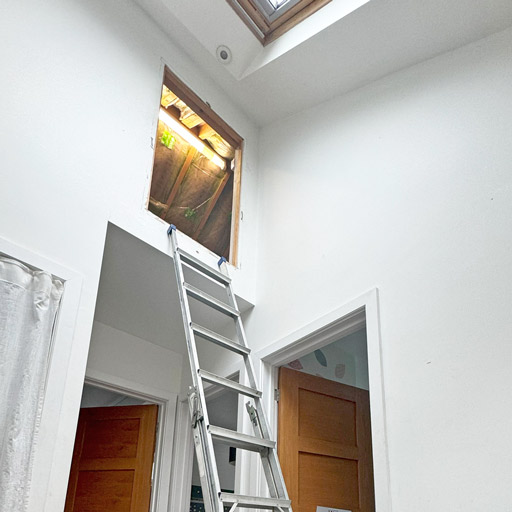 Wall aperture before installation of vertical loft ladder. Case study