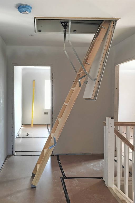 Designo loft ladder fitted within new build home to access solar inverter. Premier Loft Ladders case study