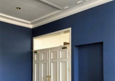 Fire-rated electric loft ladder for high-ceiling. Stretford Public Hall - Case study.