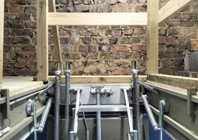 Electric fire-rated loft ladder. Installed with customer's own wooden upper-level guardrail.