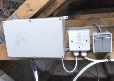 Electric loft ladder control box installed. With wall mounted control.